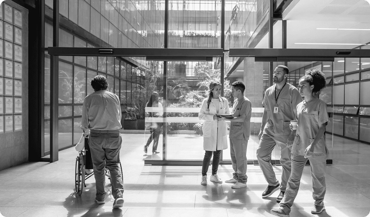 Medical staff conversing in corridor