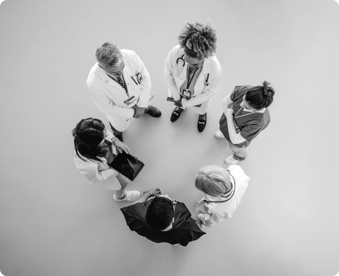 Doctors standing in a circle discussion