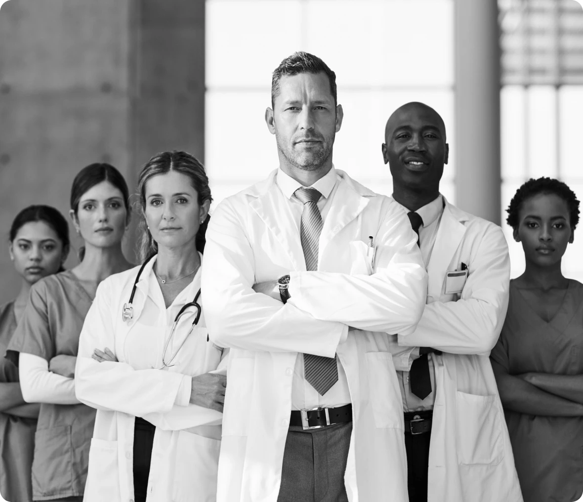Doctors and nurses standing confidently together