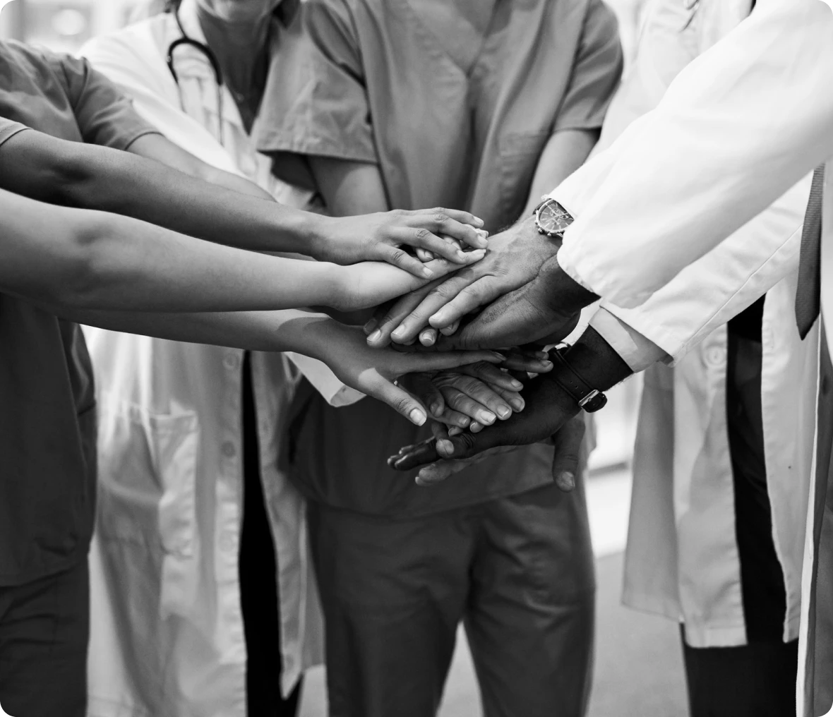 Medical team joining hands in unity