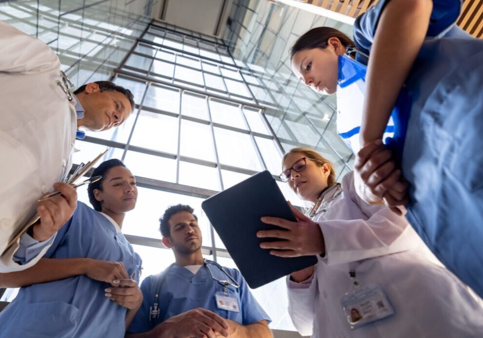 Healthcare professionals reviewing documents together